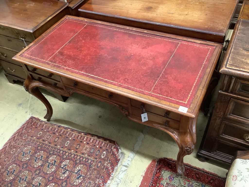 A Victorian walnut kneehole rosewood desk by Wilkinson & Son, Old Bond Street, stamped 11761, width 134cm, depth 64cm, height 75cm